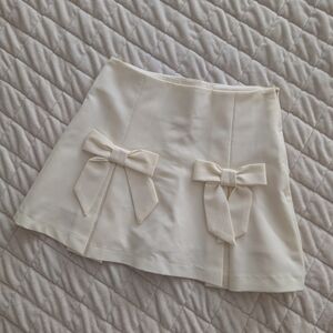 Altar'd State Cream Mini Skirt with Front Bow Accents